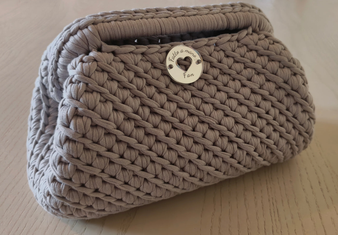 Borsa clutch con manico