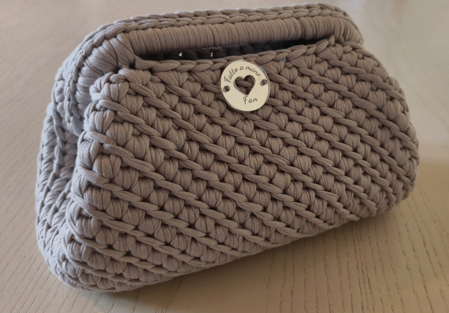 Borsa clutch con manico