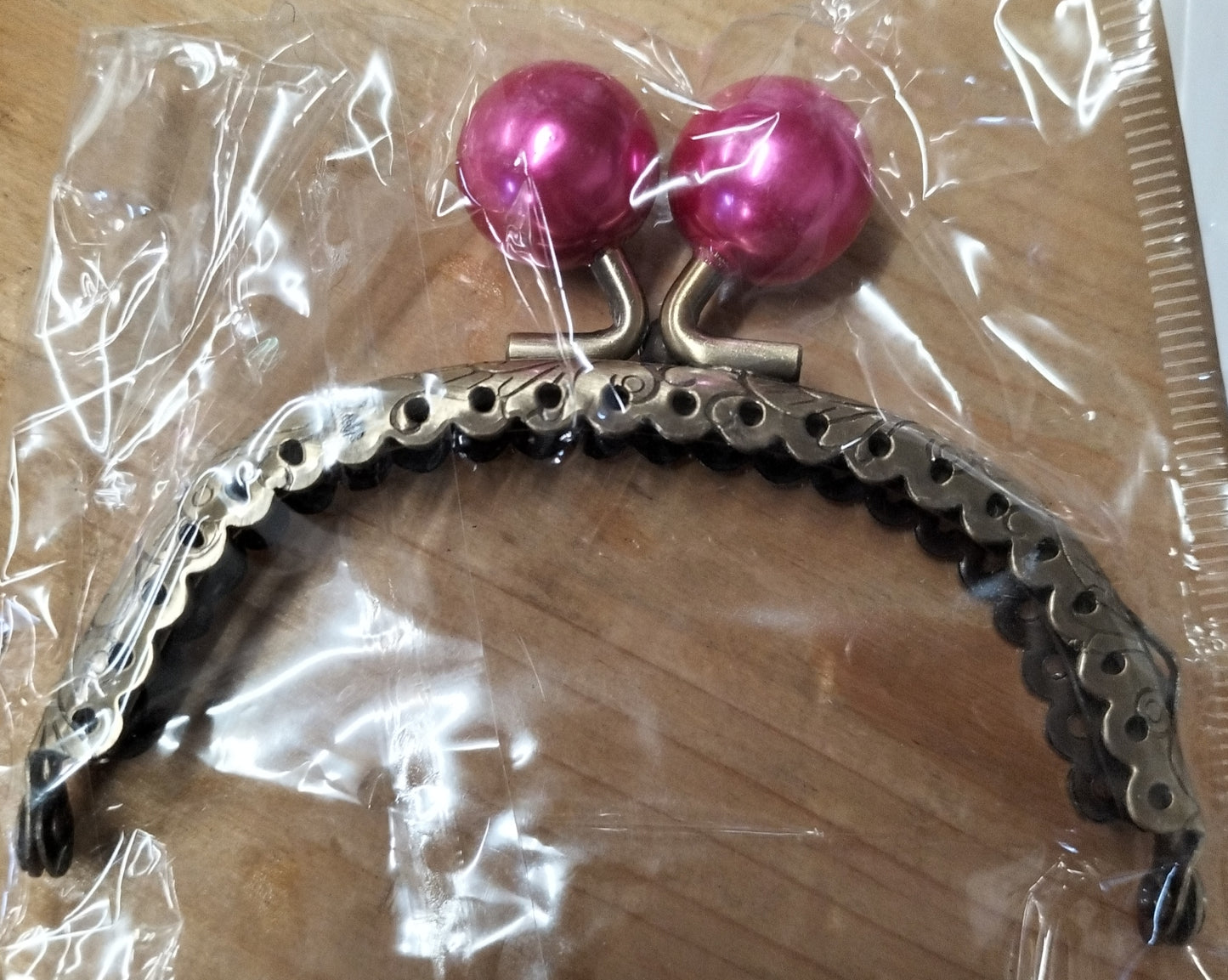 Click clack ovale colore bronzo con perla 8,5 cm