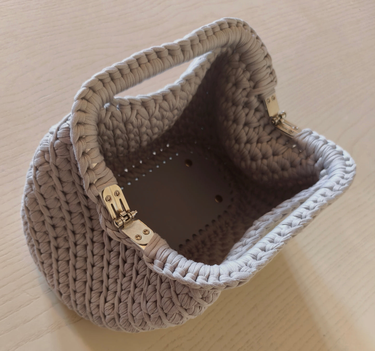 Borsa clutch con manico