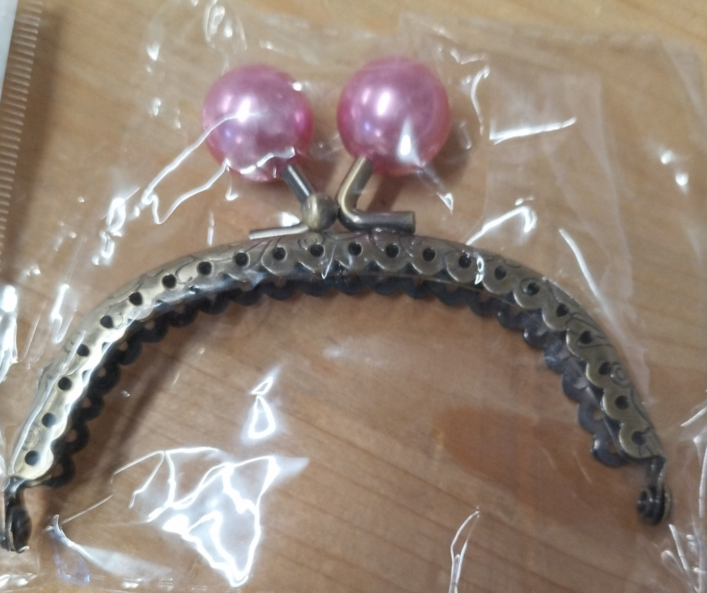 Click clack ovale colore bronzo con perla 8,5 cm